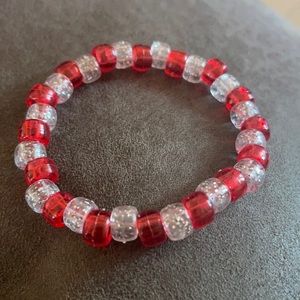 See through with sparkles and red beads.